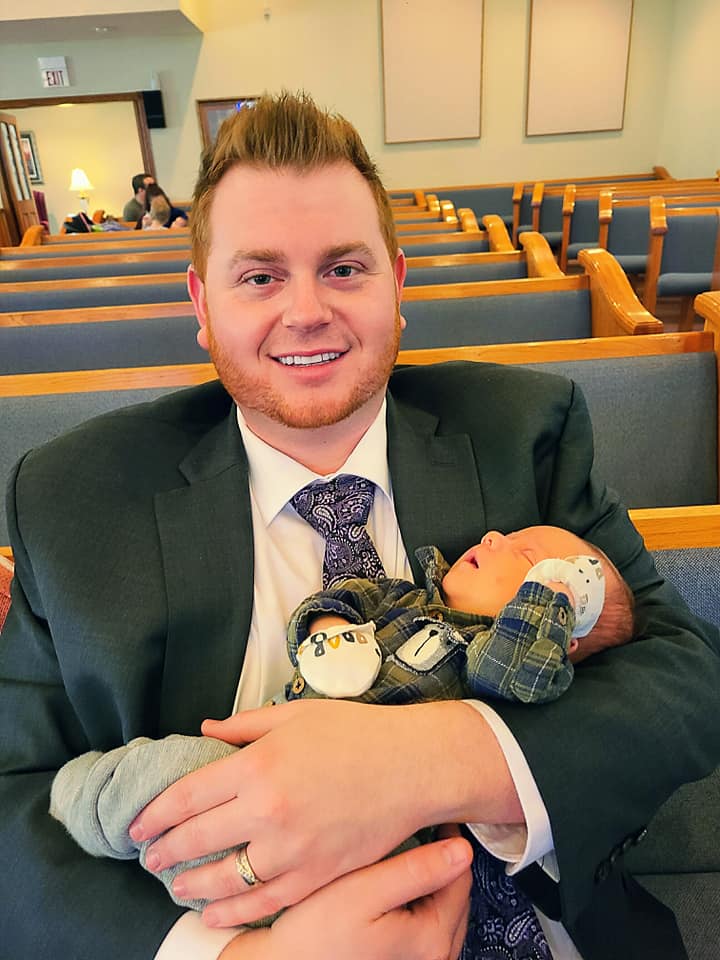 Todd Holding a Friend's Baby