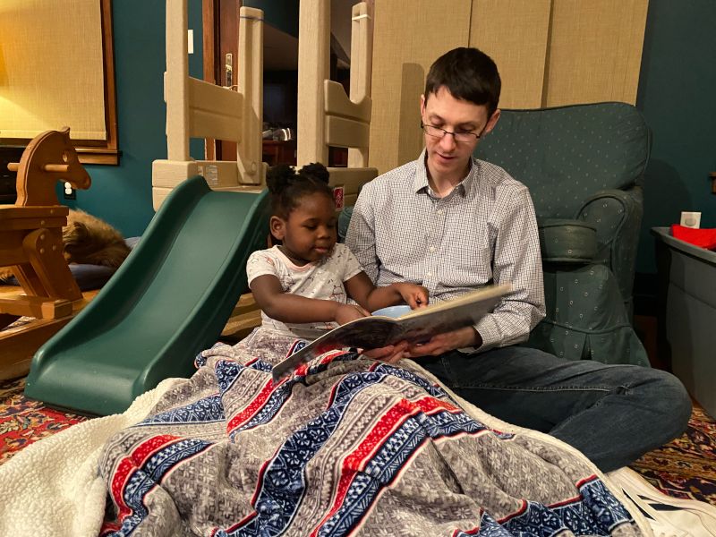 Ellis & Her Uncle Reading Together