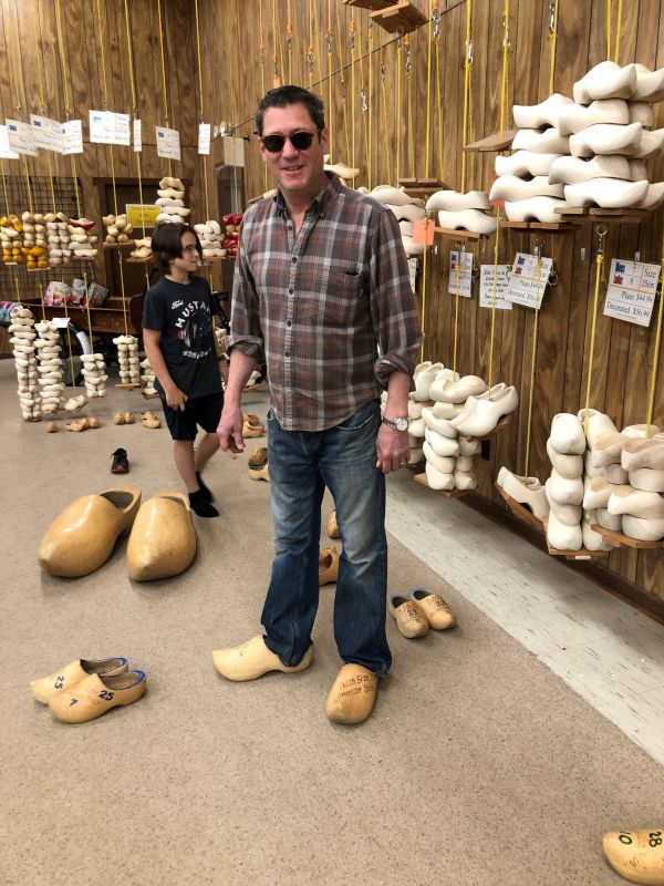 Kevin Trying on Dutch Wooden Shoes