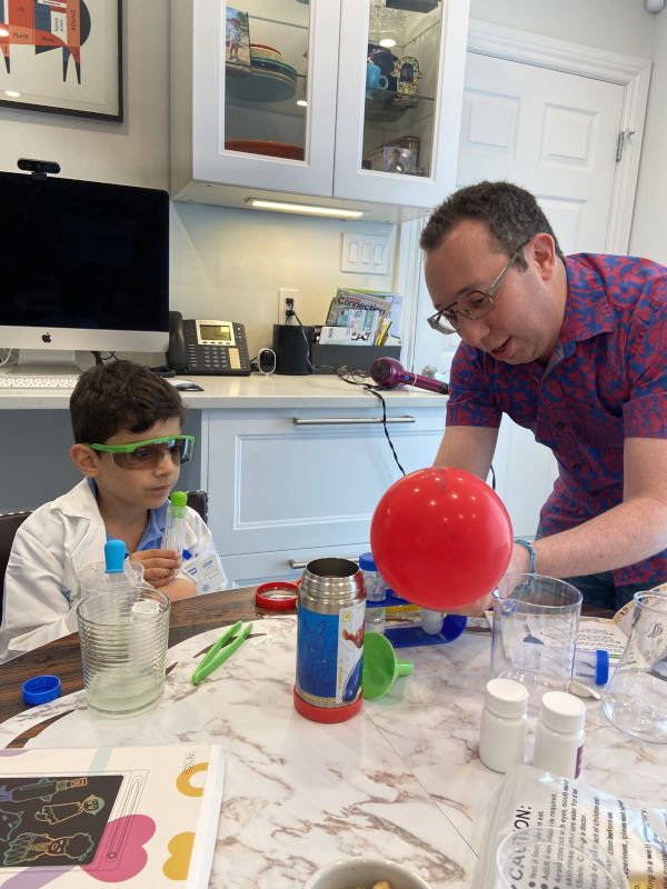 Earl Playing Scientist With His Best Friend's Son