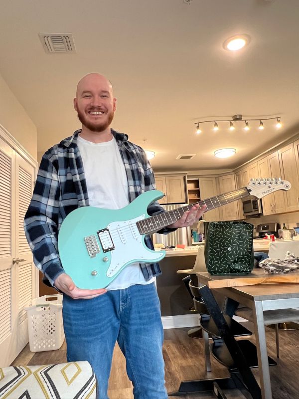 Matthew Showing Off His New Guitar