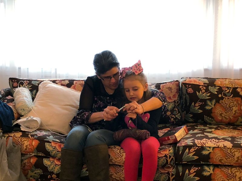 Jennifer Teaching Family How to Crochet